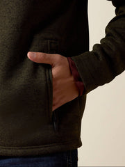 Ariat 10079650 Mens Caldwell Logo 1/4 Zip Sweater Dark Green pocket close up. If you need any assistance with this item or the purchase of this item please call us at five six one seven four eight eight eight zero one Monday through Saturday 10:00a.m EST to 8:00 p.m EST