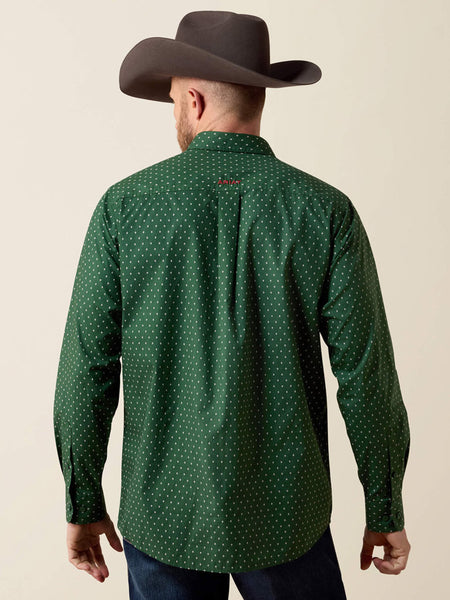A man viewed from the back wearing a dark green long-sleeve button-up shirt with a small white polka dot pattern, paired with a dark brown cowboy hat and dark jeans, against a solid beige background. If you need any assistance with this item or the purchase of this item please call us at five six one seven four eight eight eight zero one Monday through Saturday 10:00a.m EST to 8:00 p.m EST