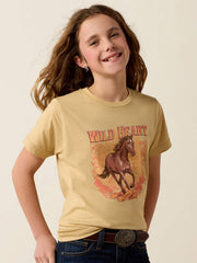 A smiling young girl with long brown hair models a beige graphic t-shirt featuring a brown horse and the words 'WILD HEART' in orange. She is wearing blue jeans with a brown leather belt. If you need any assistance with this item or the purchase of this item please call us at five six one seven four eight eight eight zero one Monday through Saturday 10:00a.m EST to 8:00 p.m EST