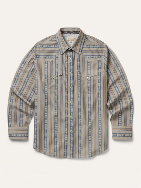 A long-sleeve western-style button-up shirt with vertical stripes in beige, brown, and slate blue, featuring a pointed collar and two buttoned chest pockets, laid flat against a light cream background. If you need any assistance with this item or the purchase of this item please call us at five six one seven four eight eight eight zero one Monday through Saturday 10:00a.m EST to 8:00 p.m EST