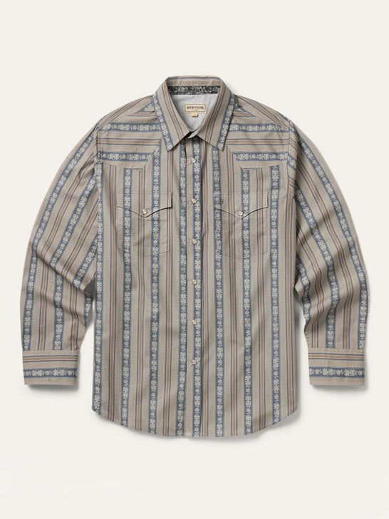 A long-sleeve western-style button-up shirt with vertical stripes in beige, brown, and slate blue, featuring a pointed collar and two buttoned chest pockets, laid flat against a light cream background. If you need any assistance with this item or the purchase of this item please call us at five six one seven four eight eight eight zero one Monday through Saturday 10:00a.m EST to 8:00 p.m EST