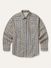 A long-sleeve western-style button-up shirt with vertical stripes in beige, brown, and slate blue, featuring a pointed collar and two buttoned chest pockets, laid flat against a light cream background. If you need any assistance with this item or the purchase of this item please call us at five six one seven four eight eight eight zero one Monday through Saturday 10:00a.m EST to 8:00 p.m EST