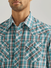 Wrangler 112337393 Mens Long Sleeve Retro Plaid Shirt Teal front close up view. If you need any assistance with this item or the purchase of this item please call us at five six one seven four eight eight eight zero one Monday through Saturday 10:00a.m EST to 8:00 p.m EST