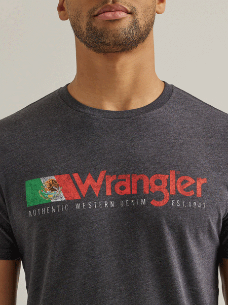 Wrangler 112344124 Mens Mexico Authentic Graphic T-Shirt Caviar Heather close up view of front graphic. If you need any assistance with this item or the purchase of this item please call us at five six one seven four eight eight eight zero one Monday through Saturday 10:00a.m EST to 8:00 p.m EST