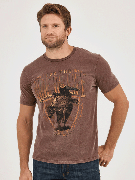 Wrangler 112361859 Mens For The Ride Of Life Graphic T-Shirt Potting Soil Brown front view. If you need any assistance with this item or the purchase of this item please call us at five six one seven four eight eight eight zero one Monday through Saturday 10:00a.m EST to 8:00 p.m EST

