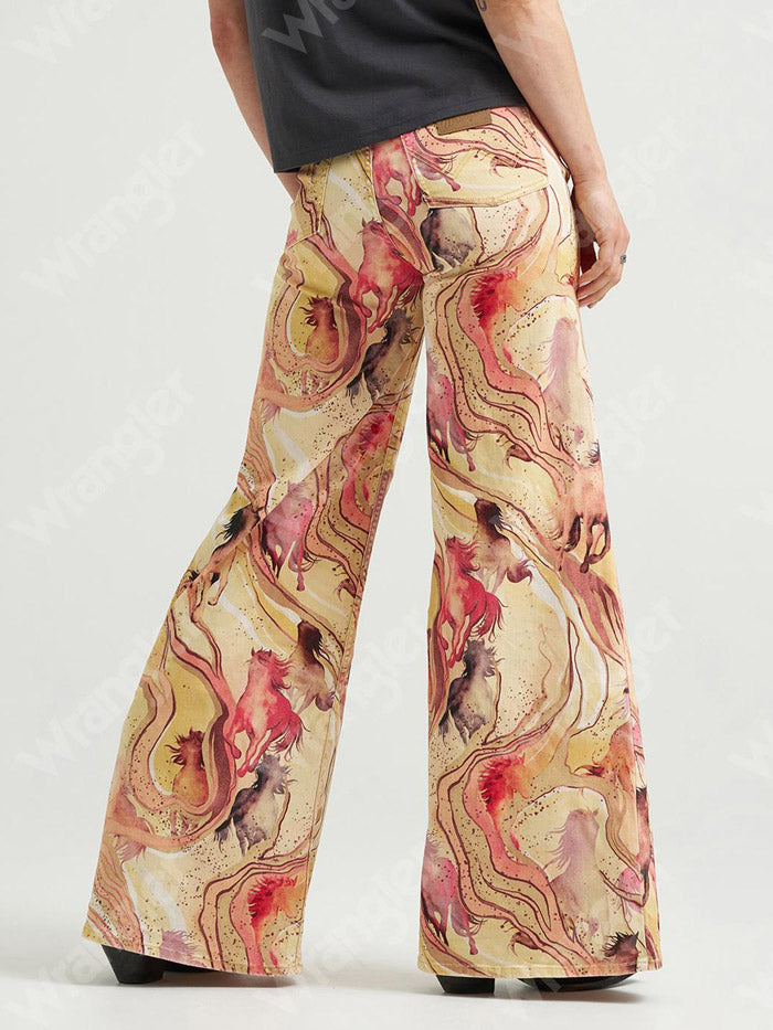 Wrangler 112382851 Womens X Lainey Wilson Cheeky Wide Leg Jean Marbled Horse front view. If you need any assistance with this item or the purchase of this item please call us at five six one seven four eight eight eight zero one Monday through Saturday 10:00a.m EST to 8:00 p.m EST