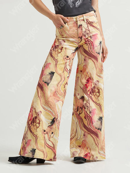 Wrangler 112382851 Womens X Lainey Wilson Cheeky Wide Leg Jean Marbled Horse front view. If you need any assistance with this item or the purchase of this item please call us at five six one seven four eight eight eight zero one Monday through Saturday 10:00a.m EST to 8:00 p.m EST