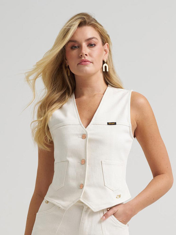 Wrangler 112385569 Womens Lainey Wilson X Iconic Denim Vest Pearl White front view. If you need any assistance with this item or the purchase of this item please call us at five six one seven four eight eight eight zero one Monday through Saturday 10:00a.m EST to 8:00 p.m EST