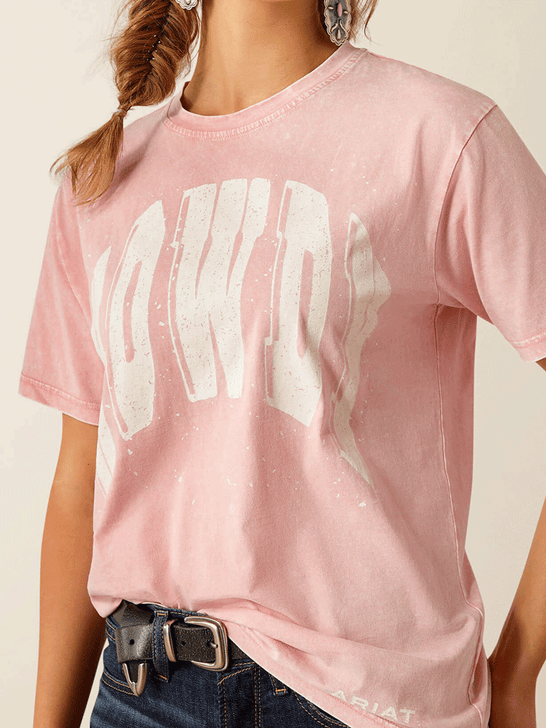 Ariat 10055130 Womens Howdy T-Shirt Acid Wash Pink front close up. If you need any assistance with this item or the purchase of this item please call us at five six one seven four eight eight eight zero one Monday through Saturday 10:00a.m EST to 8:00 p.m EST