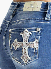 Miss Me M9352SBV Womens Cross Mid Rise Slim Boot Jean Medium Blue back close up view. If you need any assistance with this item or the purchase of this item please call us at five six one seven four eight eight eight zero one Monday through Saturday 10:00a.m EST to 8:00 p.m EST