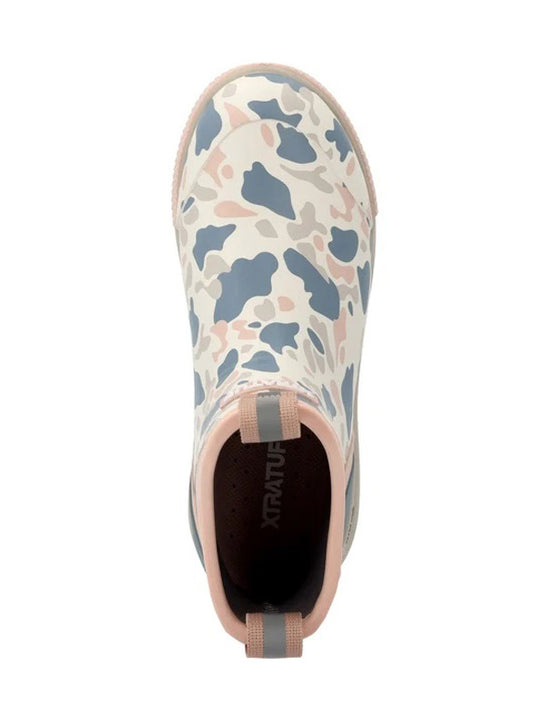 A single Xtratu brand slip-on boot with a blue, pink, and white camouflage pattern, shown from a top-down view on a white background. If you need any assistance with this item or the purchase of this item please call us at five six one seven four eight eight eight zero one Monday through Saturday 10:00a.m EST to 8:00 p.m EST