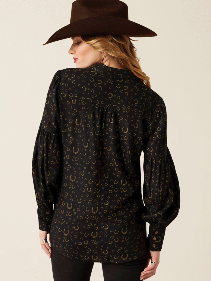 Ariat 10053979 Womens Blinged Out Top Golden Horseshoes Print Black front. If you need any assistance with this item or the purchase of this item please call us at five six one seven four eight eight eight zero one Monday through Saturday 10:00a.m EST to 8:00 p.m EST