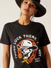 Ariat 10047839 Unisex Sendero Winking Skull T-Shirt Black front view on female model. If you need any assistance with this item or the purchase of this item please call us at five six one seven four eight eight eight zero one Monday through Saturday 10:00a.m EST to 8:00 p.m EST