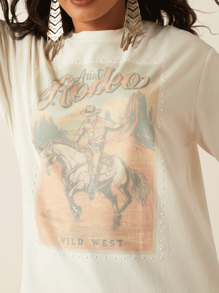 Ariat 10055140 Womens Rodeo T-Shirt Cloud Dancer front view. If you need any assistance with this item or the purchase of this item please call us at five six one seven four eight eight eight zero one Monday through Saturday 10:00a.m EST to 8:00 p.m EST