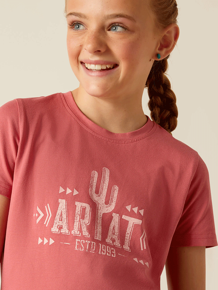 Ariat 10048593 Kids Cactus T-Shirt Slate Rose front view. If you need any assistance with this item or the purchase of this item please call us at five six one seven four eight eight eight zero one Monday through Saturday 10:00a.m EST to 8:00 p.m EST