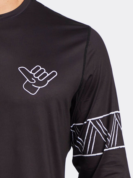 Shaka Kai Mens GET HOOKED Long Sleeve Performance Shirt Black front close up. If you need any assistance with this item or the purchase of this item please call us at five six one seven four eight eight eight zero one Monday through Saturday 10:00a.m EST to 8:00 p.m EST