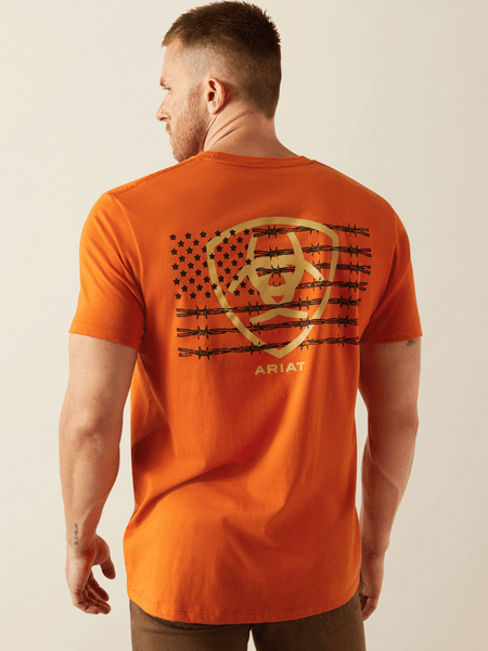 Ariat 10054774 Mens Barb Shield T-Shirt Rust back view. If you need any assistance with this item or the purchase of this item please call us at five six one seven four eight eight eight zero one Monday through Saturday 10:00a.m EST to 8:00 p.m EST