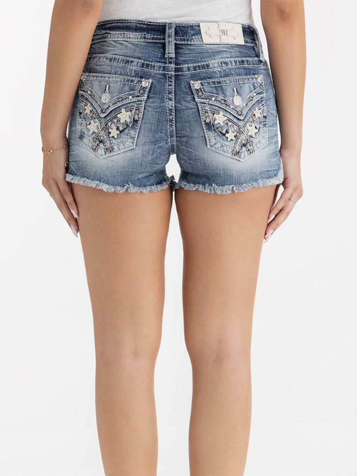 Miss Me M3444H138 Womens Stars Align Denim Shorts Medium Wash back close up. If you need any assistance with this item or the purchase of this item please call us at five six one seven four eight eight eight zero one Monday through Saturday 10:00a.m EST to 8:00 p.m EST