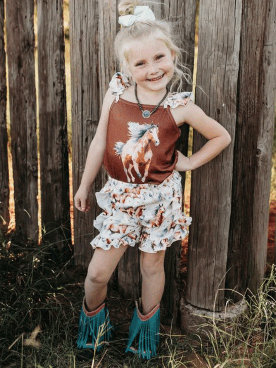 Shea Baby MGS14 Kids Running Horse Set Brown on model. If you need any assistance with this item or the purchase of this item please call us at five six one seven four eight eight eight zero one Monday through Saturday 10:00a.m EST to 8:00 p.m EST

