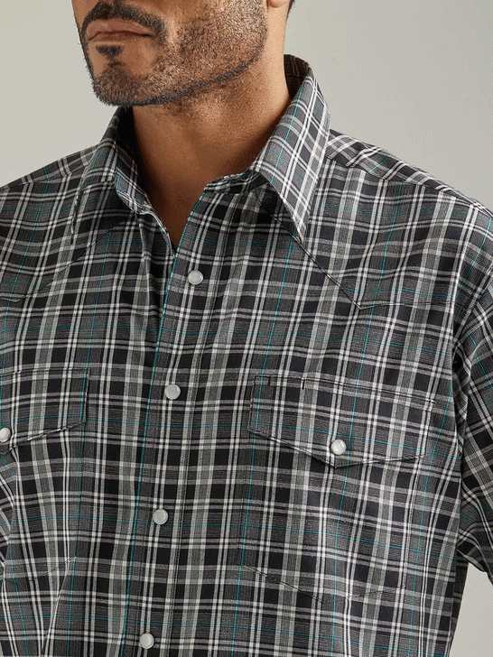 Wrangler 112326367 Mens Wrinkle Resist Short Sleeve Western Snap Plaid Shirt Black Knight front close up view of pocket and collar. If you need any assistance with this item or the purchase of this item please call us at five six one seven four eight eight eight zero one Monday through Saturday 10:00a.m EST to 8:00 p.m EST