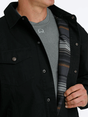 Cinch MWJ1598001 Mens Canvas Ranch Coat Black lininig view. If you need any assistance with this item or the purchase of this item please call us at five six one seven four eight eight eight zero one Monday through Saturday 10:00a.m EST to 8:00 p.m EST