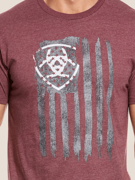Ariat 10029003 Mens Vertical Flag T-Shirt Burgundy Heather close up of front graphic. If you need any assistance with this item or the purchase of this item please call us at five six one seven four eight eight eight zero one Monday through Saturday 10:00a.m EST to 8:00 p.m EST