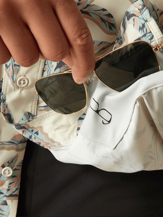 Ariat 10058789 Mens VentTEK Outbound Classic Fit Shirt Papyrus Cream lens cloth view. If you need any assistance with this item or the purchase of this item please call us at five six one seven four eight eight eight zero one Monday through Saturday 10:00a.m EST to 8:00 p.m EST