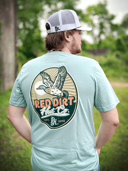 Red Dirt RDHC-T-182 Mens Big Duck Energy Tee Dusty Blue back view. If you need any assistance with this item or the purchase of this item please call us at five six one seven four eight eight eight zero one Monday through Saturday 10:00a.m EST to 8:00 p.m EST