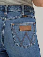Wrangler 112338900 Womens Retro Premium High Rise Slim Boot Jean Abigail close up view of back pocket. If you need any assistance with this item or the purchase of this item please call us at five six one seven four eight eight eight zero one Monday through Saturday 10:00a.m EST to 8:00 p.m EST