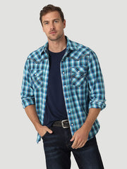 Wrangler 112326348 Mens Rock 47 Long Sleeve Western Snap Shirt Vibrant Blue front view on model. If you need any assistance with this item or the purchase of this item please call us at five six one seven four eight eight eight zero one Monday through Saturday 10:00a.m EST to 8:00 p.m EST