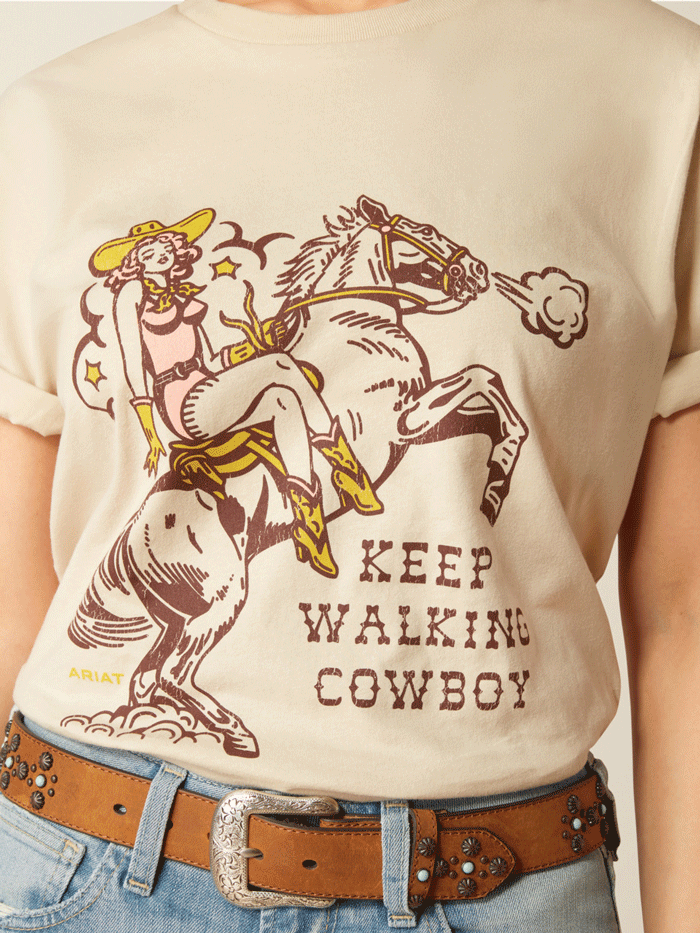 Ariat 10052542 Womens Keep Walkin' Cowboy Tee Natural front view. If you need any assistance with this item or the purchase of this item please call us at five six one seven four eight eight eight zero one Monday through Saturday 10:00a.m EST to 8:00 p.m EST