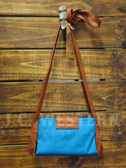 Catchfly 2054700 Womens Jessica Crossbody Wallet Turquoise back view hanging. If you need any assistance with this item or the purchase of this item please call us at five six one seven four eight eight eight zero one Monday through Saturday 10:00a.m EST to 8:00 p.m EST