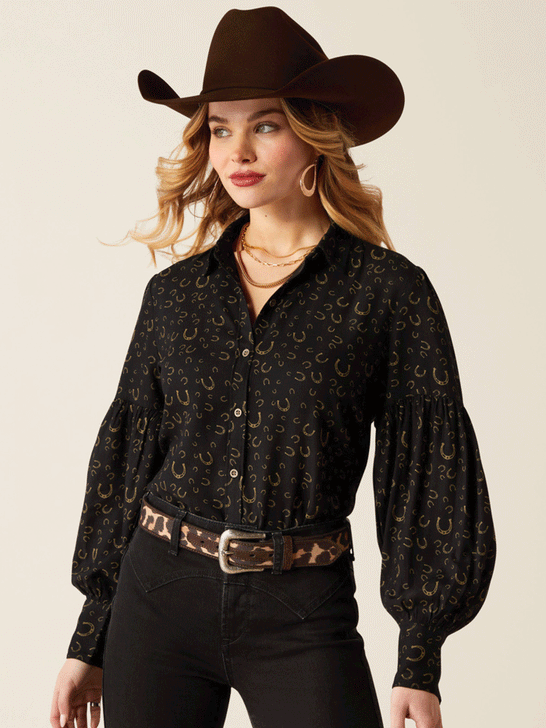 Ariat 10053979 Womens Blinged Out Top Golden Horseshoes Print Black front. If you need any assistance with this item or the purchase of this item please call us at five six one seven four eight eight eight zero one Monday through Saturday 10:00a.m EST to 8:00 p.m EST