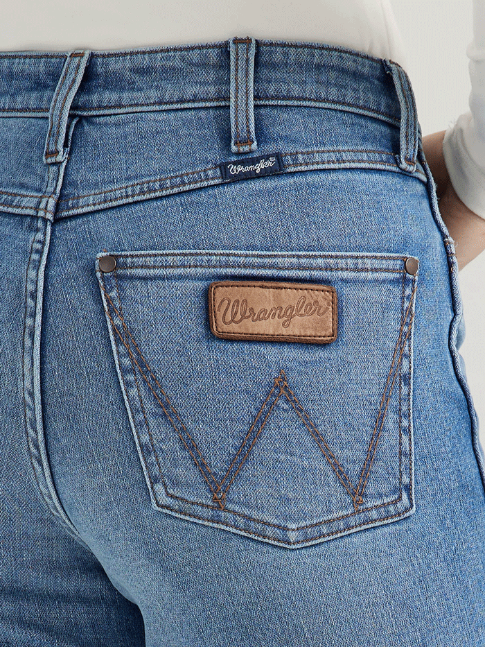 Wrangler 112356680 Womens Retro Bailey High Rise Bootcut Jean Kelly front. If you need any assistance with this item or the purchase of this item please call us at five six one seven four eight eight eight zero one Monday through Saturday 10:00a.m EST to 8:00 p.m EST