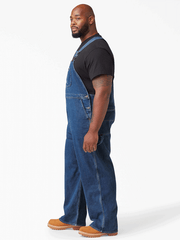 Dickies 8396SNB Mens Bib Overall Indigo Stone Washed side view big and tall. If you need any assistance with this item or the purchase of this item please call us at five six one seven four eight eight eight zero one Monday through Saturday 10:00a.m EST to 8:00 p.m EST