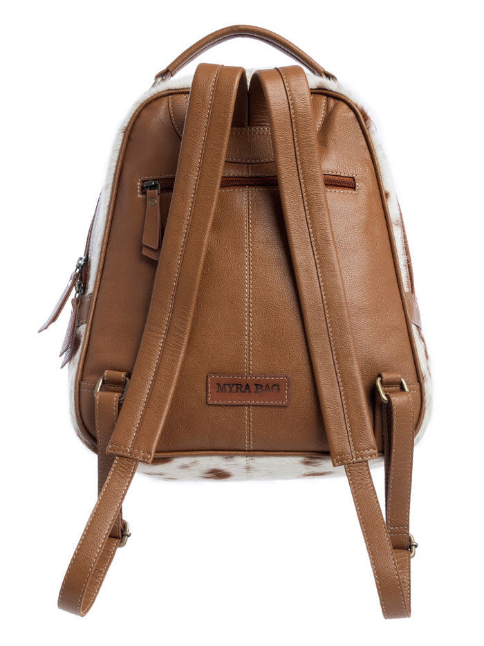 Myra Bag S-10724 Womens La Jara Hand-Tooled Backpack Bag Brown side / front view. If you need any assistance with this item or the purchase of this item please call us at five six one seven four eight eight eight zero one Monday through Saturday 10:00a.m EST to 8:00 p.m EST