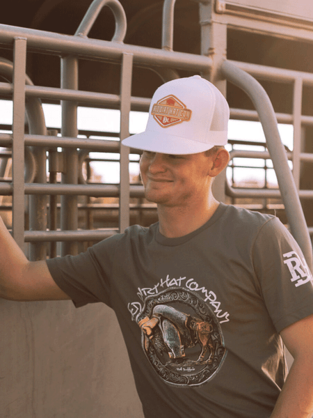 Red Dirt RDHC-395 NINER Trucker Cap White on model. If you need any assistance with this item or the purchase of this item please call us at five six one seven four eight eight eight zero one Monday through Saturday 10:00a.m EST to 8:00 p.m EST
