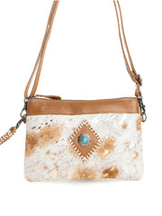 Myra Bag S-9974 Womens Eye of the Goddess Crossbody Bag in Caramel Brown close up. If you need any assistance with this item or the purchase of this item please call us at five six one seven four eight eight eight zero one Monday through Saturday 10:00a.m EST to 8:00 p.m EST