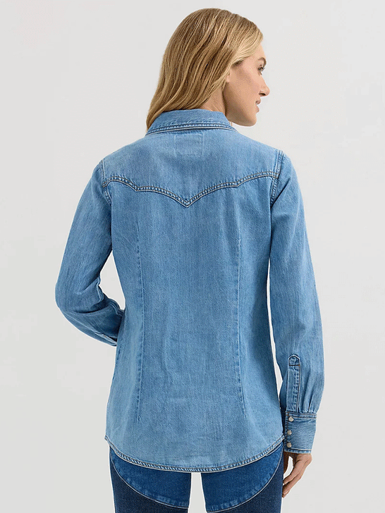 Wrangler 112360616 Womens X Lainey Wilson Moxie Western Denim Shirt Mid Wash Light Blue back view. If you need any assistance with this item or the purchase of this item please call us at five six one seven four eight eight eight zero one Monday through Saturday 10:00a.m EST to 8:00 p.m EST

