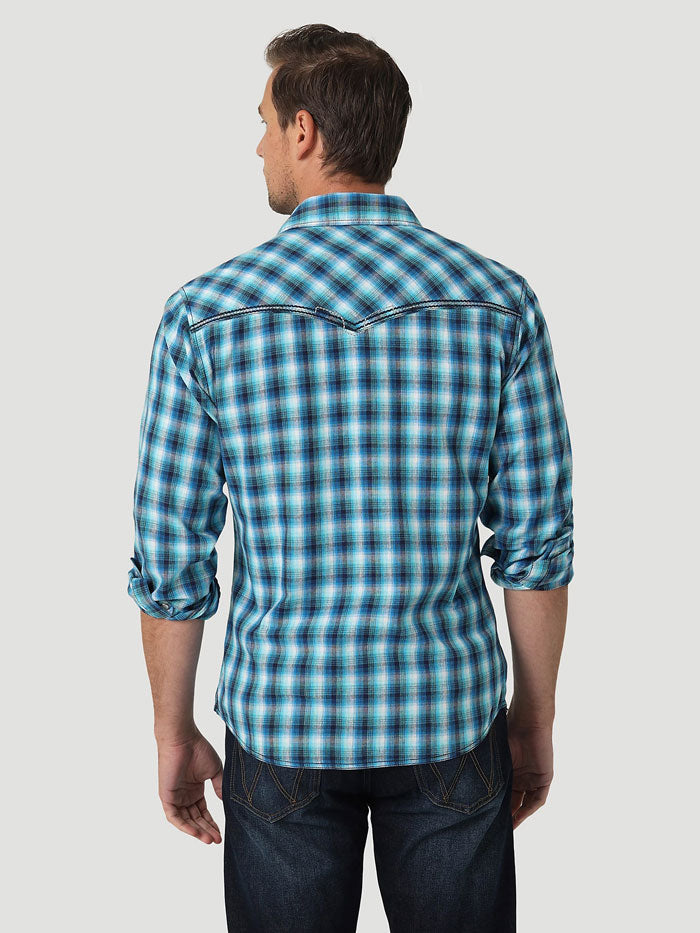 Wrangler 112326348 Mens Rock 47 Long Sleeve Western Snap Shirt Vibrant Blue front view on model. If you need any assistance with this item or the purchase of this item please call us at five six one seven four eight eight eight zero one Monday through Saturday 10:00a.m EST to 8:00 p.m EST