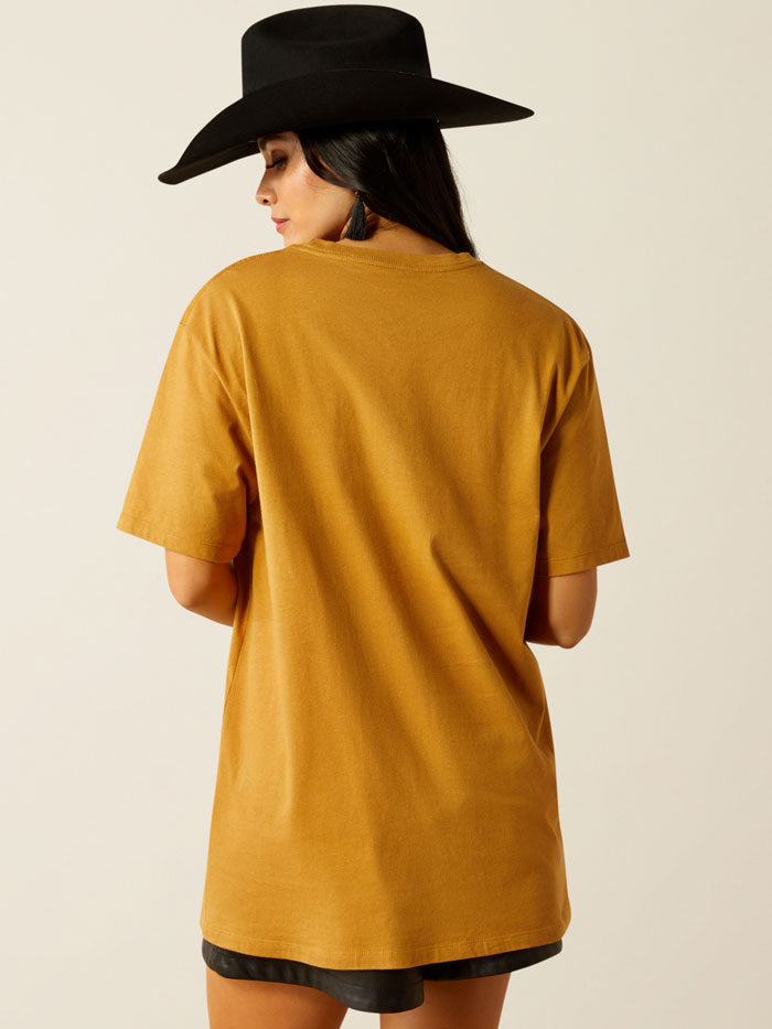 Ariat 10054029 Womens Highlander T-Shirt Harvest Gold front view. If you need any assistance with this item or the purchase of this item please call us at five six one seven four eight eight eight zero one Monday through Saturday 10:00a.m EST to 8:00 p.m EST