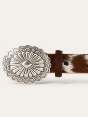 Stetson 9411790 Womens Hair-On-Hide Southwestern Buckle Belt Brown buckle close up. If you need any assistance with this item or the purchase of this item please call us at five six one seven four eight eight eight zero one Monday through Saturday 10:00a.m EST to 8:00 p.m EST