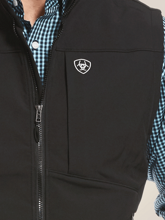 Ariat 10028321 Mens Logo 2.0 Softshell Vest Black front close up view. If you need any assistance with this item or the purchase of this item please call us at five six one seven four eight eight eight zero one Monday through Saturday 10:00a.m EST to 8:00 p.m EST