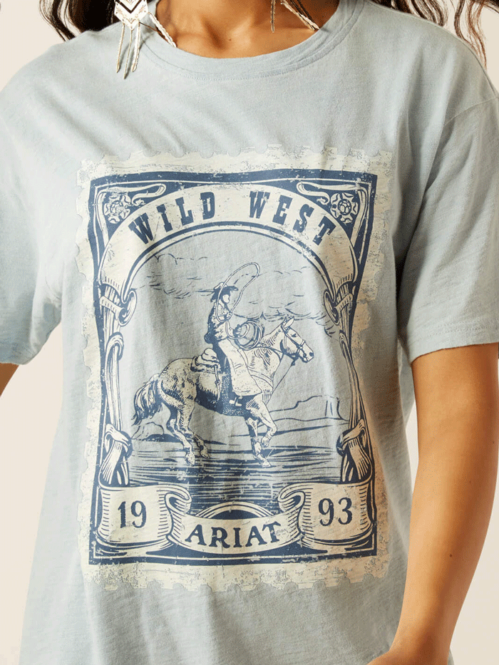 Ariat 10055128 Womens Wild West Stamp T-Shirt Bleached Blue front view. If you need any assistance with this item or the purchase of this item please call us at five six one seven four eight eight eight zero one Monday through Saturday 10:00a.m EST to 8:00 p.m EST