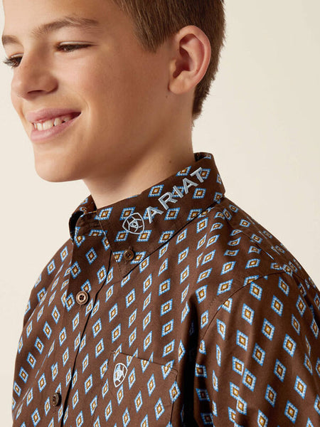 Ariat 10054069 Kids Team Oak Classic Fit Shirt Brownlight Blue collar close up. If you need any assistance with this item or the purchase of this item please call us at five six one seven four eight eight eight zero one Monday through Saturday 10:00a.m EST to 8:00 p.m EST