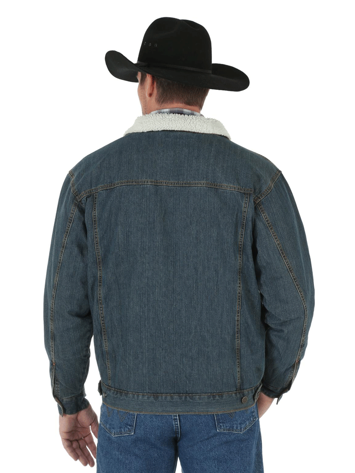 Wrangler 74256RT Mens Western Sherpa Lined Denim Trucker Jacket Rustic front view on model. If you need any assistance with this item or the purchase of this item please call us at five six one seven four eight eight eight zero one Monday through Saturday 10:00a.m EST to 8:00 p.m EST