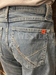 Wrangler FRCV42V Mens Flame Resistant Vintage Boot Jean Denim back pocket close up. If you need any assistance with this item or the purchase of this item please call us at five six one seven four eight eight eight zero one Monday through Saturday 10:00a.m EST to 8:00 p.m EST