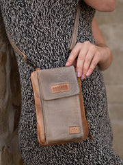 Bed Stu A450319-OTICRS-X Womens Alelike Essentials Crossbody Bag Oats Icicle Rustic front view on model.If you need any assistance with this item or the purchase of this item please call us at five six one seven four eight eight eight zero one Monday through Saturday 10:00a.m EST to 8:00 p.m EST