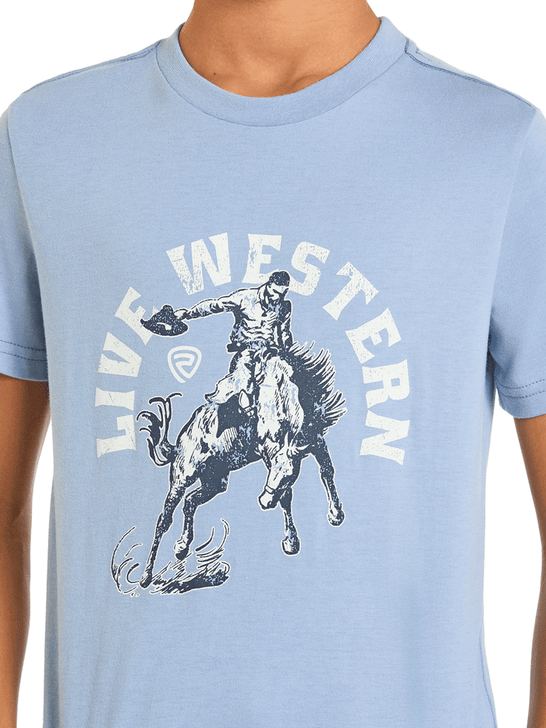Light blue t-shirt with a graphic of a cowboy on a horse and 'Live Western' text close up view. If you need any assistance with this item or the purchase of this item please call us at five six one seven four eight eight eight zero one Monday through Saturday 10:00a.m EST to 8:00 p.m EST