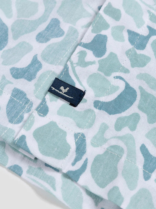 Beach & Barn WOODLANDS Mens Short Sleeve Sport Shirt Slate logo close up. If you need any assistance with this item or the purchase of this item please call us at five six one seven four eight eight eight zero one Monday through Saturday 10:00a.m EST to 8:00 p.m EST